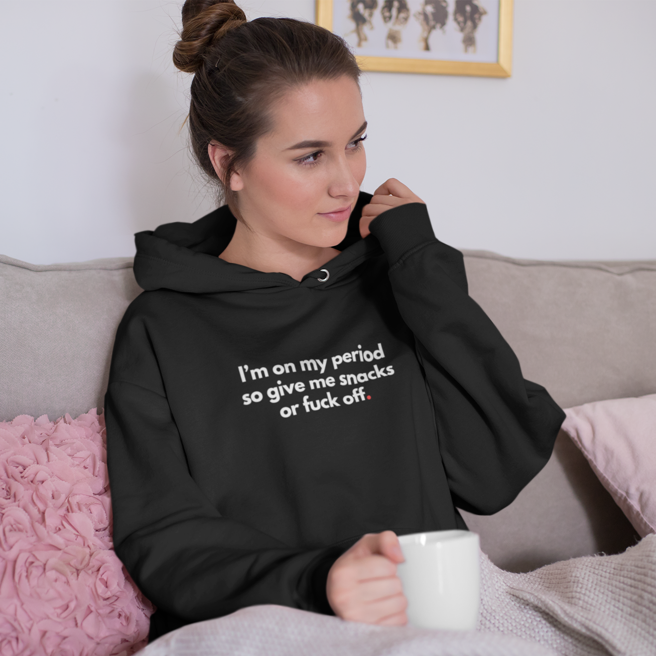 mockup-of-a-comfy-woman-adjusting-her-hoodie-on-her-couch-23205_1.png