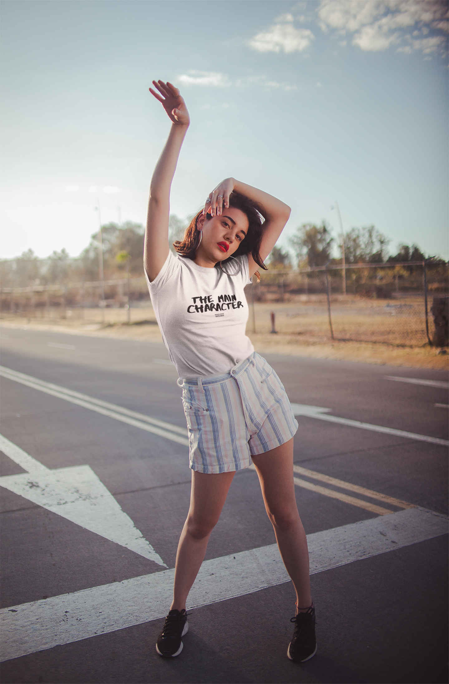 t-shirt-mockup-featuring-an-appealing-woman-posing-on-a-road-19681.png