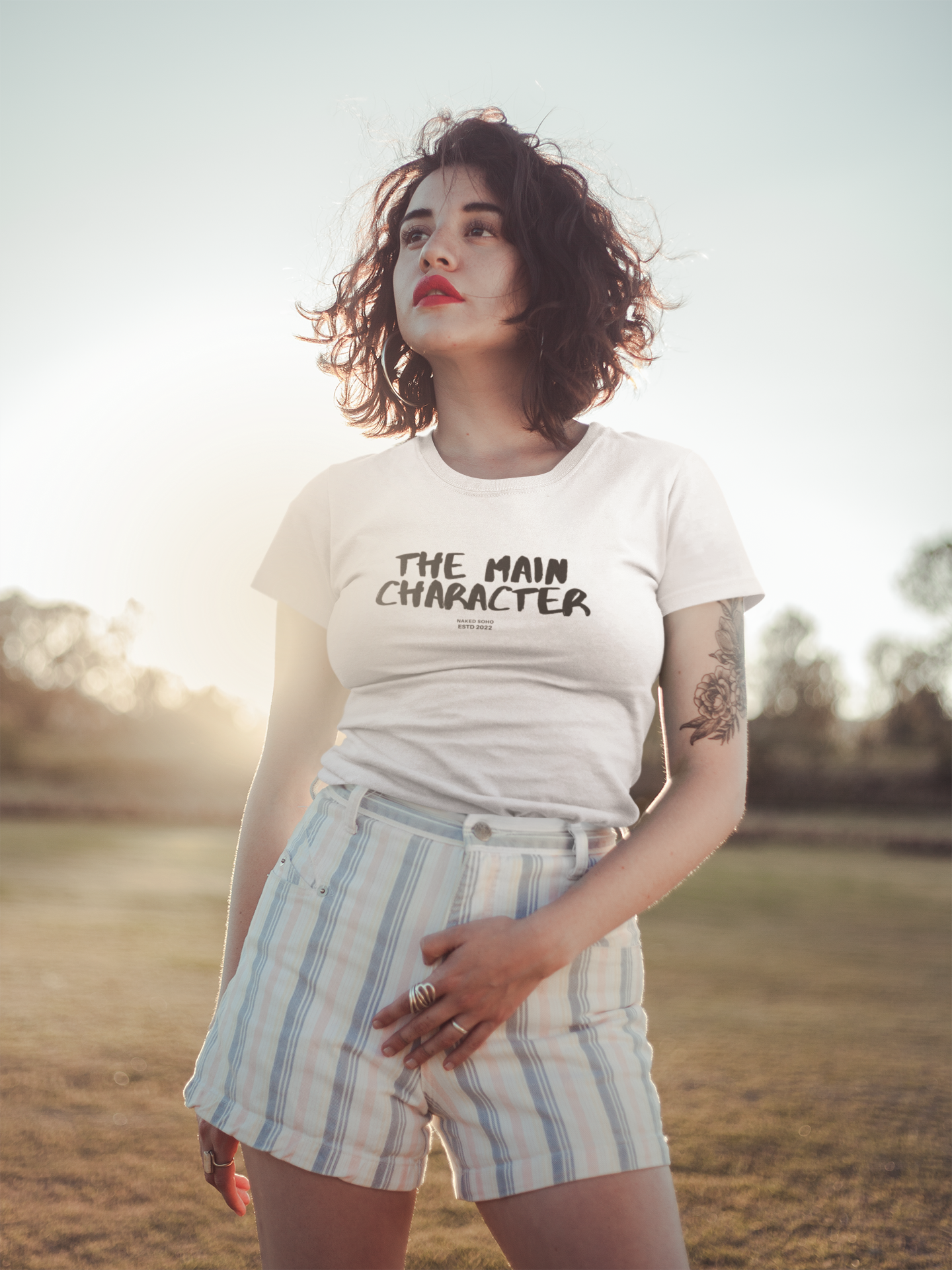 t-shirt-mockup-of-a-young-woman-in-the-field-19742.png