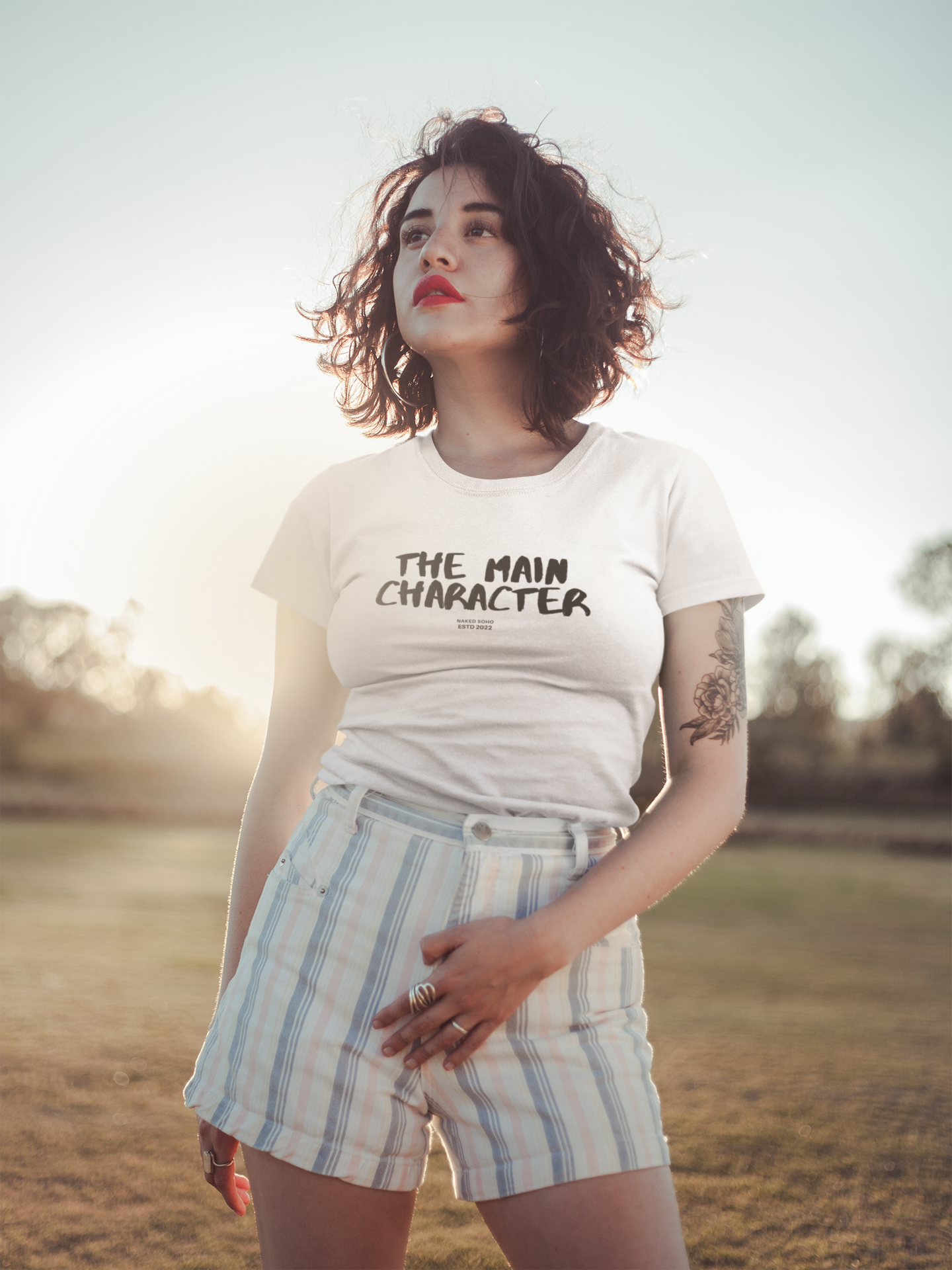 t-shirt-mockup-of-a-young-woman-in-the-field-19742_1.png
